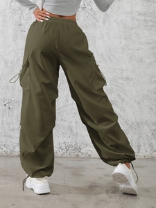 Women's olive green cargo pants with drawstring waist and large side pockets
