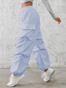 Women's light blue high waist cargo pants with side pockets and adjustable drawstring hem