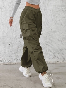 Women's army green cargo pants featuring high waist drawstring and large side flap pockets