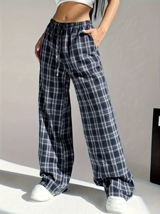 Detail of high waist plaid wide leg trousers with adjustable drawstring and elastic waistband