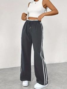 Pantalon de sport noir taille haute pour femme avec rayures latérales et cordon de serrage