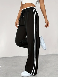 Pantalon de sport noir à jambes larges pour femme avec rayures blanches et taille haute