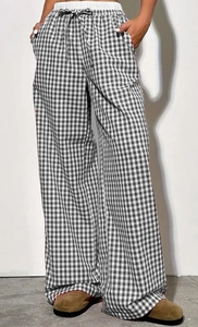 Detail of high-waist gingham wide-leg pants with drawstring and contrast inner lining