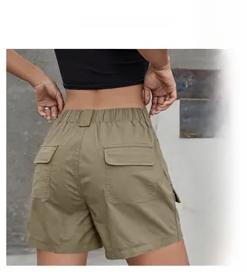 Detail view of olive green cargo shorts with elastic high waist and back flap pockets