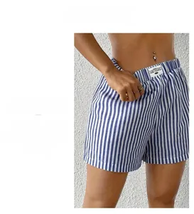 Close-up of women's blue white striped shorts with elastic waist and Las Vegas label