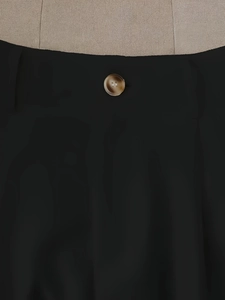 Women high-waisted black wide-leg shorts featuring a vintage tortoise button detail