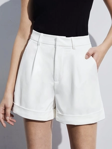 Women's high waist white A-line shorts with elegant pleated details and rolled hem