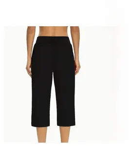 Close-up of high-waisted ice silk cropped pants showing elastic quick-dry fabric texture