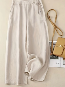 High-waist loose linen wide-leg pants in beige with drawstring waist and side pockets