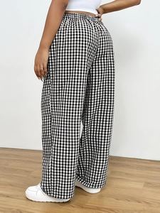 Women's plus size high waisted wide leg trousers in black and white gingham pattern
