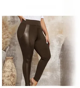 Macro view of high-waist leggings with textured faux leather side paneling in brown