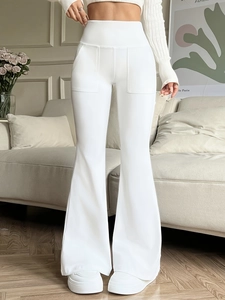White high-waisted flare pants for women with front pockets and slimming fit silhouette