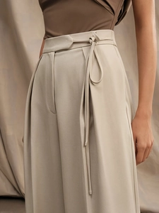 High-waist wide-leg trousers in beige featuring refined waist-tie detailing for women