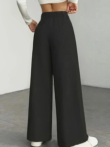 Women high waist vertical striped wide leg pants in black with flowy straight fit drape
