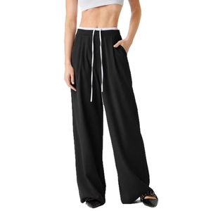 Detail of high waist double-layered straight leg trousers with white drawstrings in black