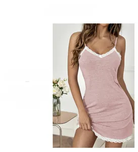 Detail of light pink nightdress with white lace hem and slim fit v-neckline