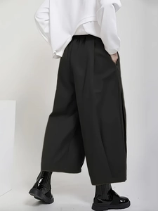 Women's plus size black high waisted wide leg culottes with side slits and draped fit