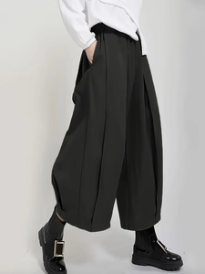 High-waist black wide-leg pleated trousers with a loose fit and flowy silhouette for women