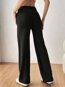 Rear view of elegant high-waisted black wide-leg trousers with a smooth drape
