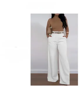 Detailed view of high waisted white wide leg pants with a slim decorative brown belt