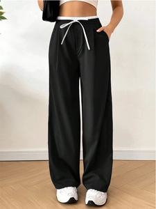 Women's high waist black wide leg trousers with stylish white drawstring detailing
