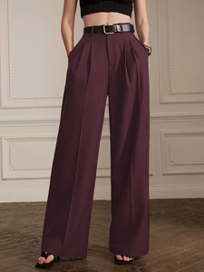 Deep purple high-waisted wide-leg trousers with elegant pleats and a black slim belt
