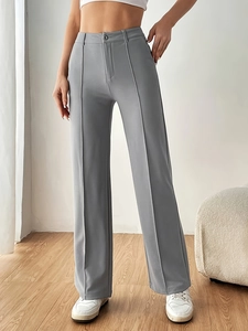 High-waisted light grey wide-leg suit trousers with sharp center press pleats for women