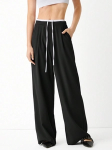 Women's black wide-leg trousers with white elastic waist and long drawstring detail
