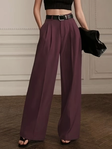 Women's high waist purple wide leg pleated trousers with a black belt and draped fit
