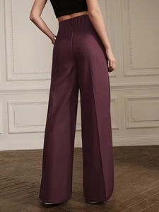 Elegant purple high-waisted pleated wide-leg trousers with a draped slimming fit