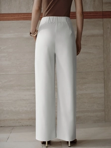 Elegant high-waisted white wide-leg trousers for women with elastic draped design
