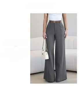 Detail view of high-waist straight wide-leg trousers with center crease and brown belt