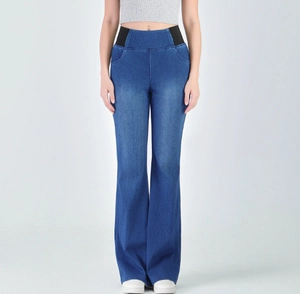 Detail of high waist flared jeans with black elastic side panels for tummy control