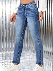 Detail of high waist slim fit blue jeans featuring stylish side silver chain decoration