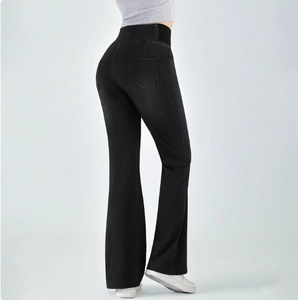 Detail view of high waisted flared jeans with elastic waistband and push-up effect