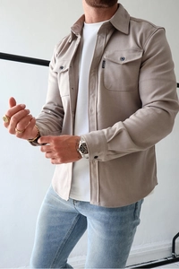 Close-up of casual brushed men's shacket with buttoned chest pockets and collar detail