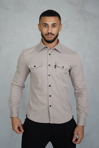 Detailed view of men's casual slim-fit shirt with double chest pockets and CAPO label