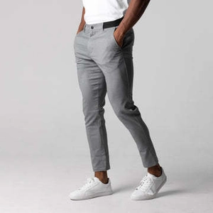 Side view of men's slim fit light grey cotton chinos with dark waist ribbon detail