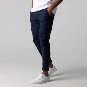 Side view of men's navy slim fit cotton trousers showing the drape and texture