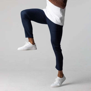Close-up of navy slim-fit men's trousers showing stretch fabric and flexible fit