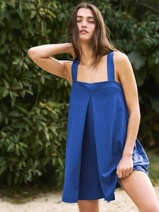 Detail view of royal blue square neck sleeveless dress with elegant pleated design