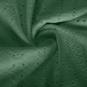 Macro detail of dark green eyelet lace fabric with geometric diamond hollow patterns