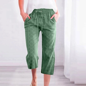 Detail view of grass green drawstring waist and diamond pattern on cropped trousers