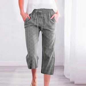 Detail view of gray printed cropped pants featuring a drawstring waist and side pockets