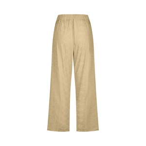 Detail of light khaki wide leg trousers with textured diamond pattern and elastic waist