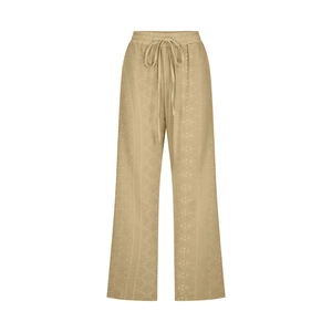 Close-up of khaki drawstring wide-leg pants with textured jacquard floral pattern detail