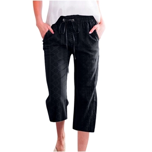 Detail of black drawstring cropped pants featuring intricate diamond textured jacquard fabric