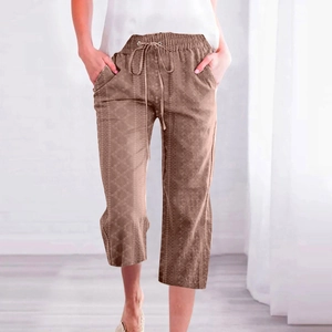 Detailed view of drawstring waist and geometric diamond pattern on khaki cropped pants