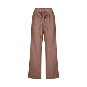 Detailed macro view of textured coffee brown fabric with drawstring elastic high waistband