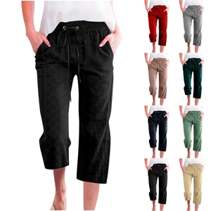 Close-up of women's drawstring cropped pants showing various colors and fabric textures